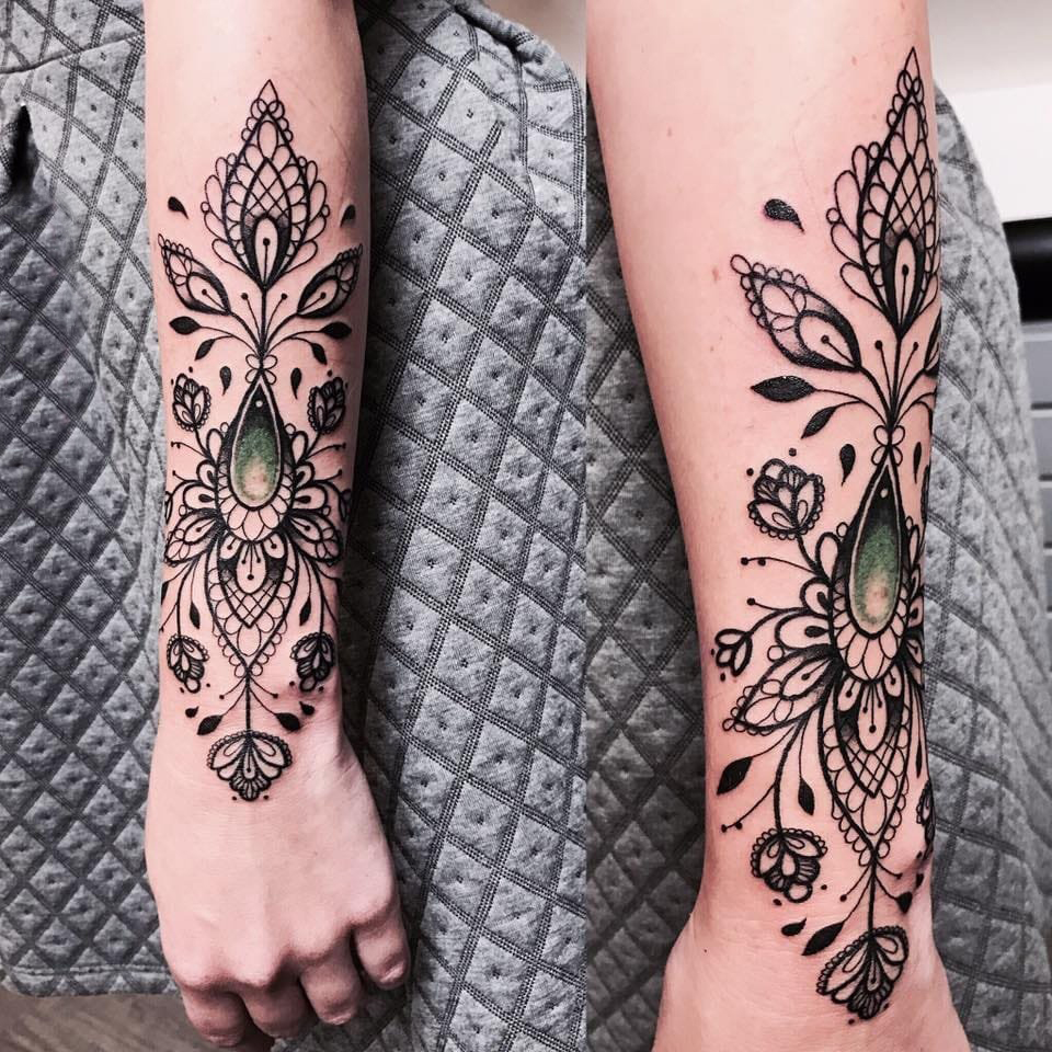 Ornamental style tattoo on the forearm for women