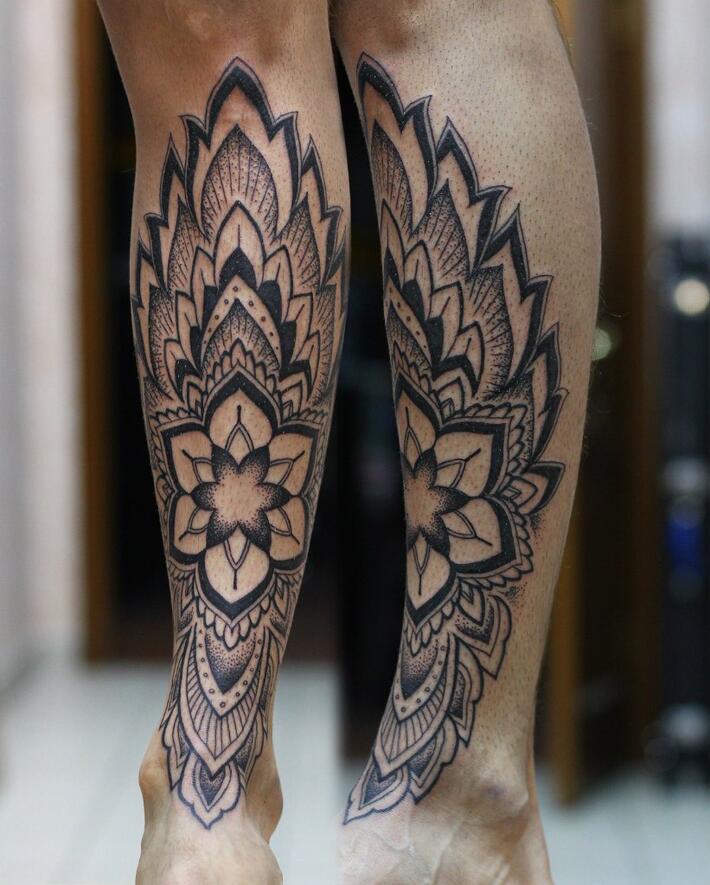 Ornamental style shin tattoo for men