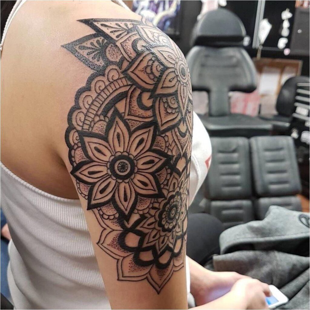 Ornamental style tattoo on the shoulder for women