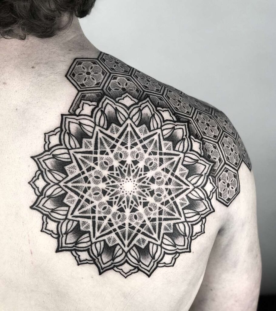 Ornamental style tattoo on the shoulder blade for men