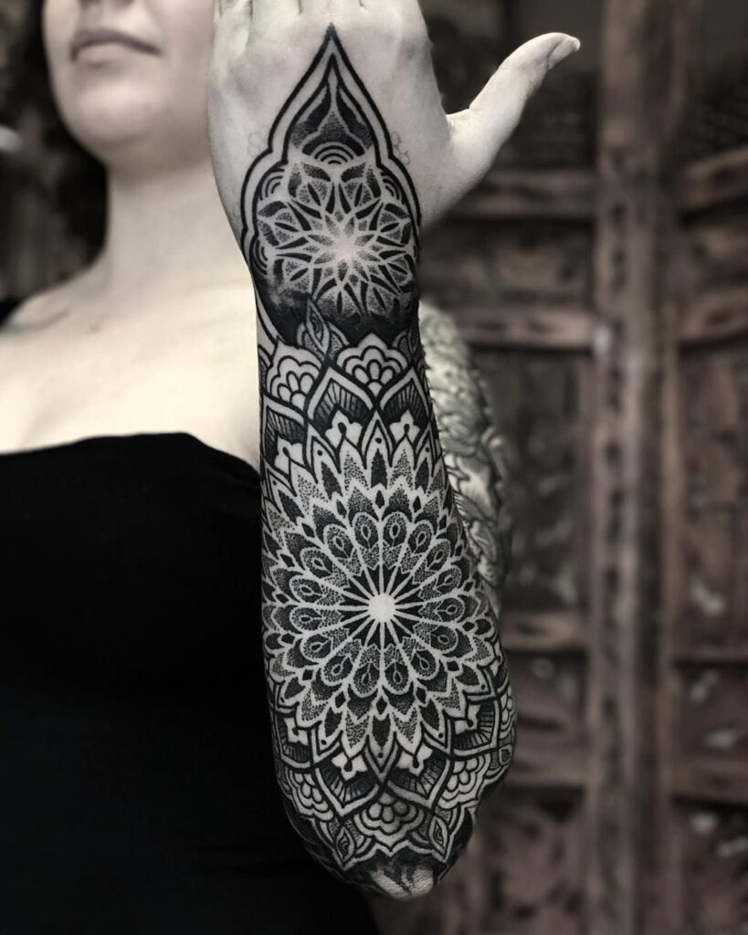 Ornamental style tattoo on the forearm for women