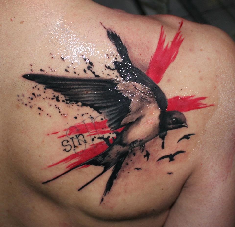 Thrash polka swallow tattoo on the shoulder blade for men