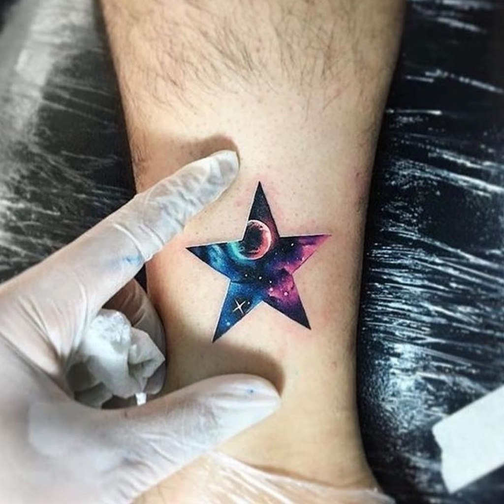 Star tattoo on the shin for women