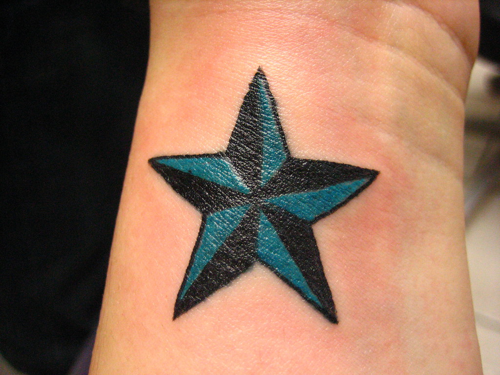 Star tattoo on wrist for women