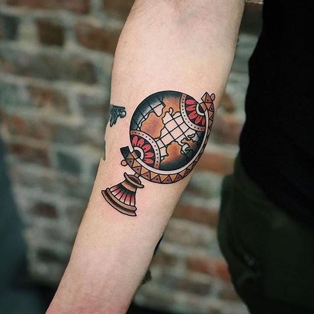 Globe tattoo on forearm for men