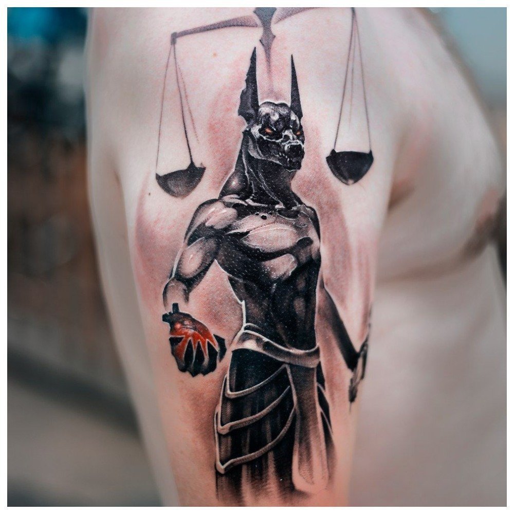 Anubis tattoo on the shin for men