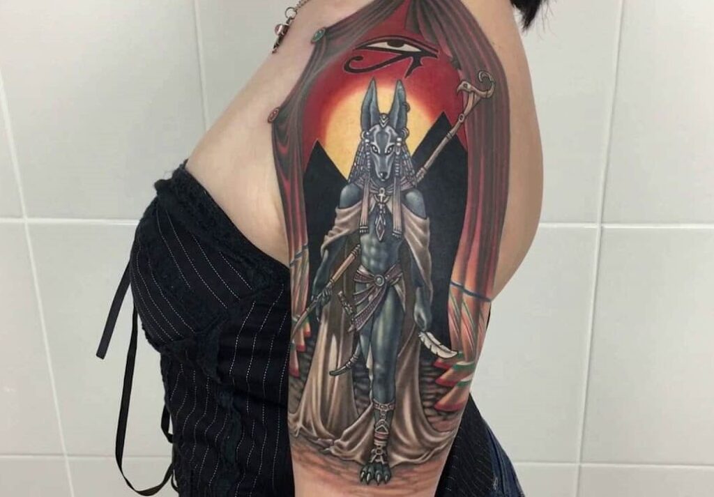 Anubis tattoo on the shoulder for women