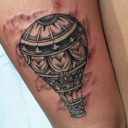 Balloon tattoo on leg for men