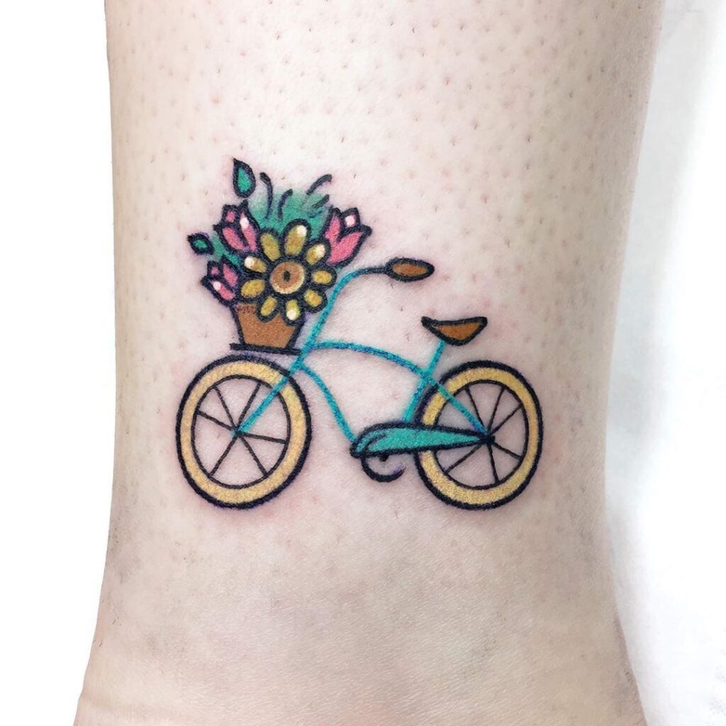 Bicycle tattoo on the shin for women