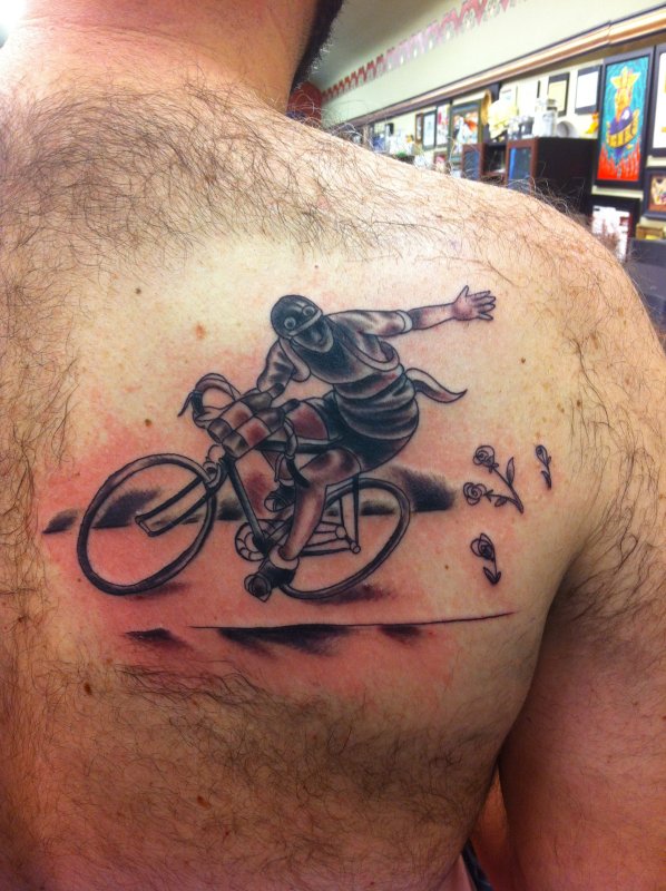 Bicycle tattoo on shoulder blade for men