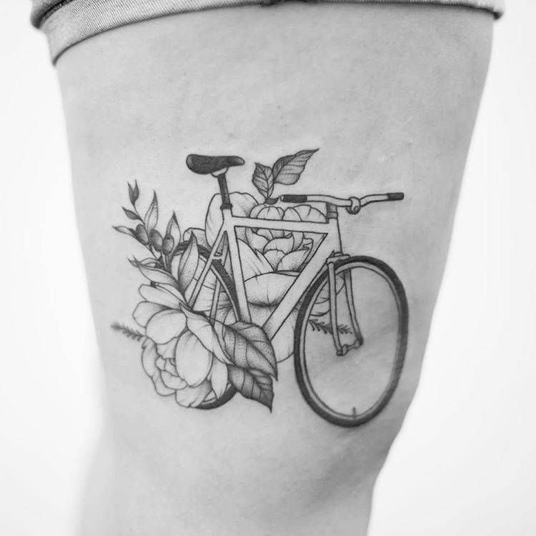 Bicycle and flowers tattoo on the leg for women