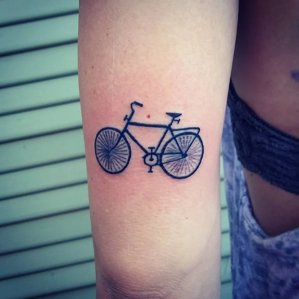 Bicycle tattoo on shoulder for women