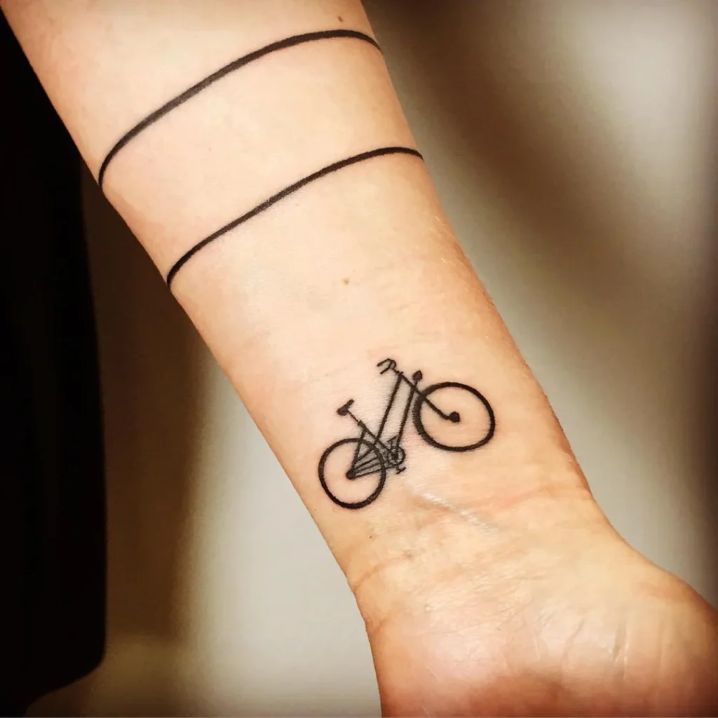 Bicycle tattoo on wrist for women