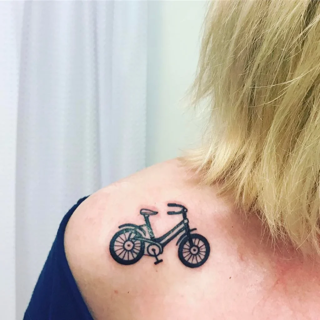 Bicycle tattoo on shoulder for women