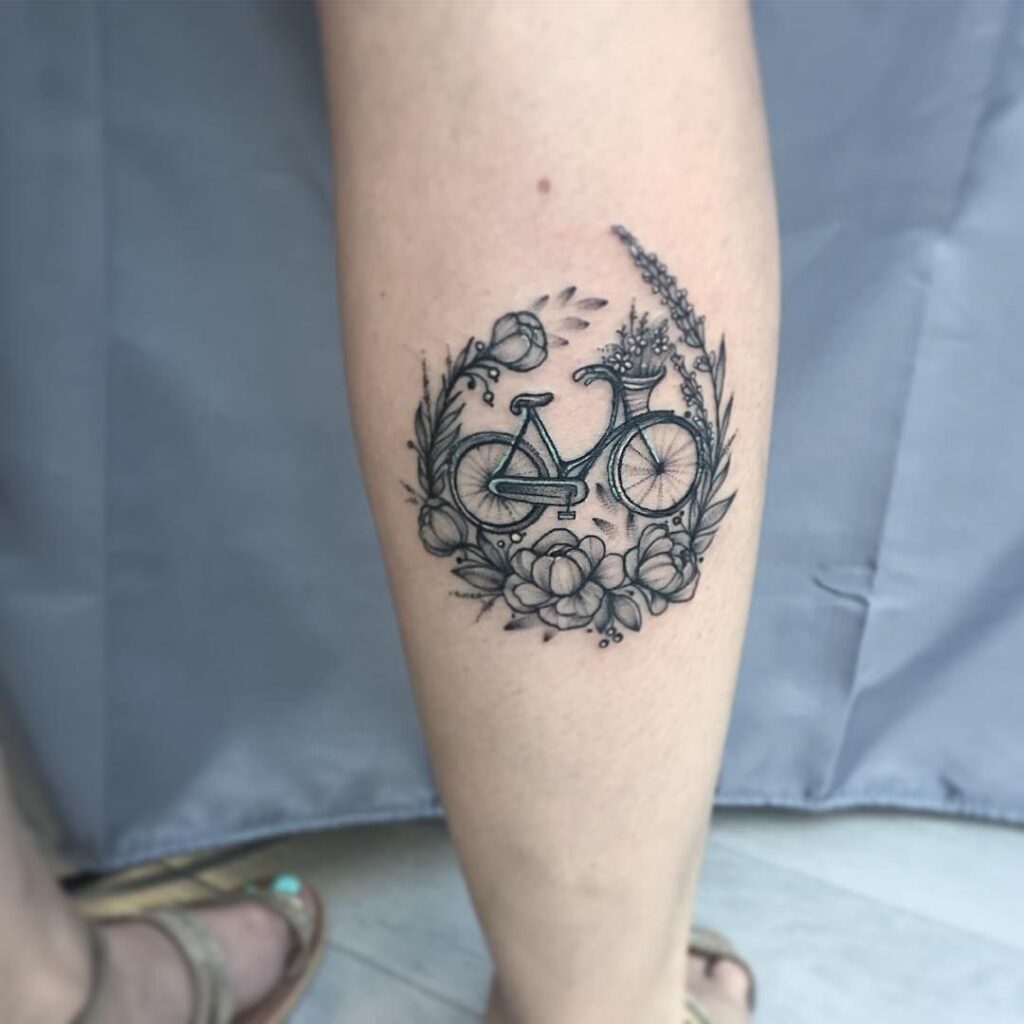 Bicycle tattoo on calf for women