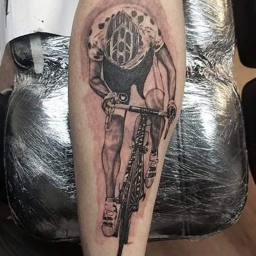 Large bicycle tattoo on the calf for men