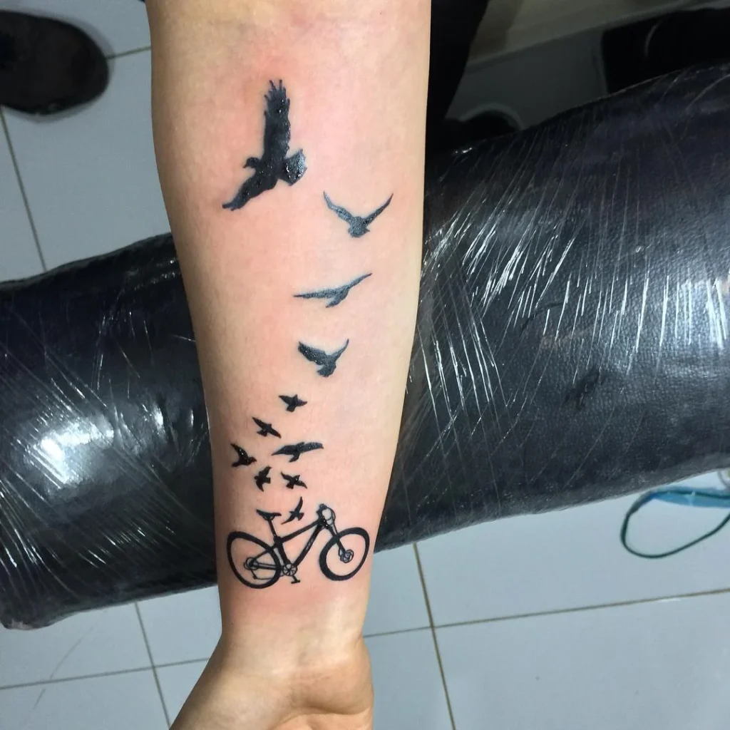 Bicycle tattoo on forearm for men