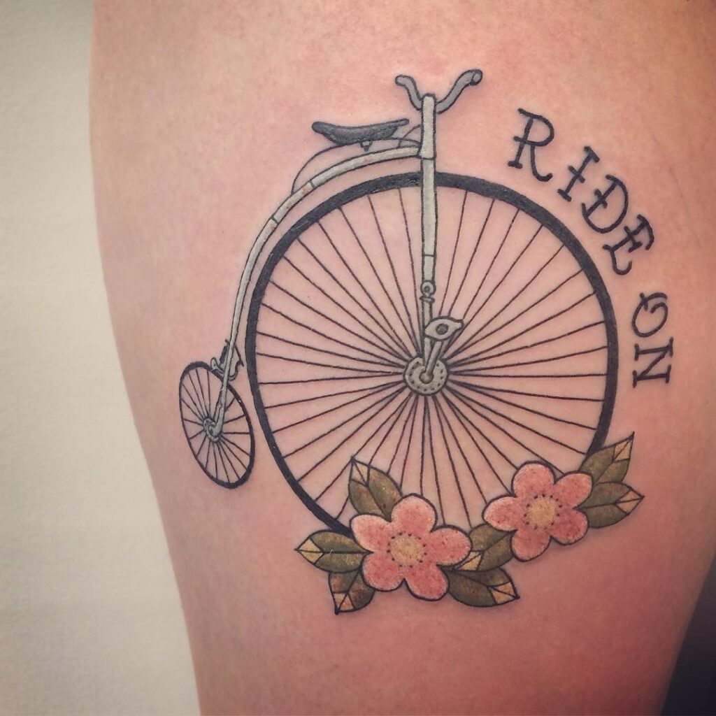 Bicycle and flowers tattoo on forearm for men