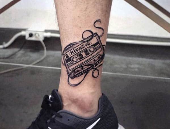 Tattoo a cassette tape on the shin for men