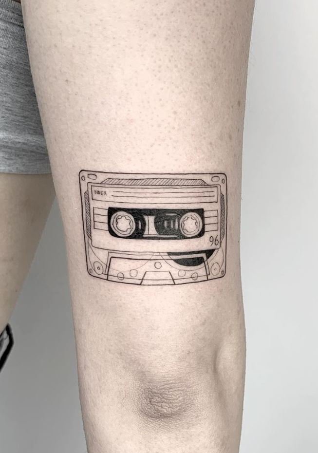 Cassette tape tattoo on the thigh for women