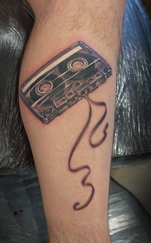 Tattoo a cassette tape on the leg for men