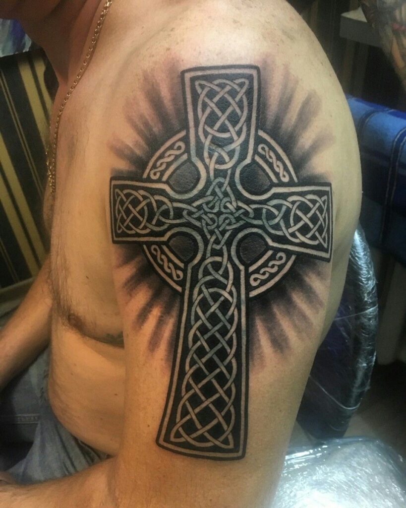 Large celtic cross tattoo on the shoulder for men