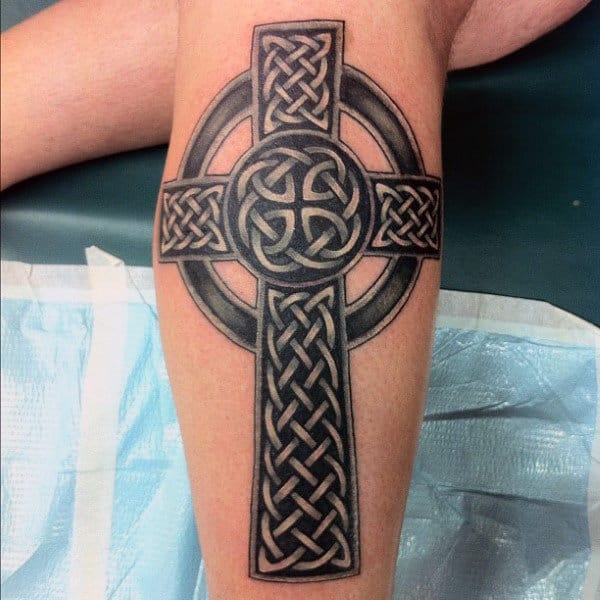 Large celtic cross tattoo on the leg for men