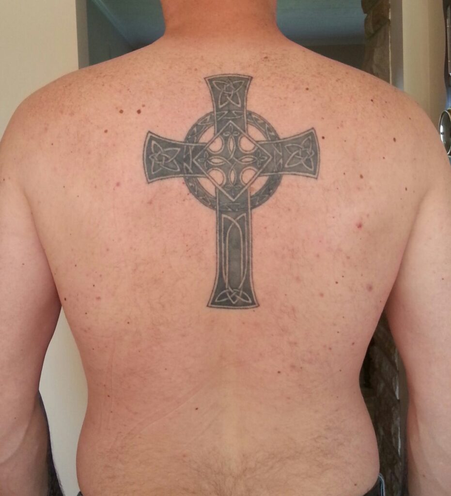 Celtic cross tattoo on back for men