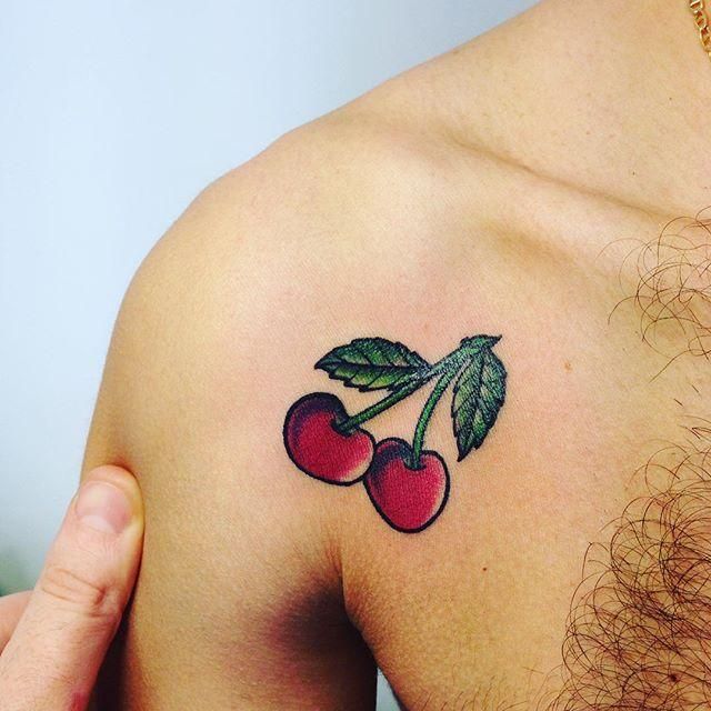 Cherry tattoo on shoulder for men