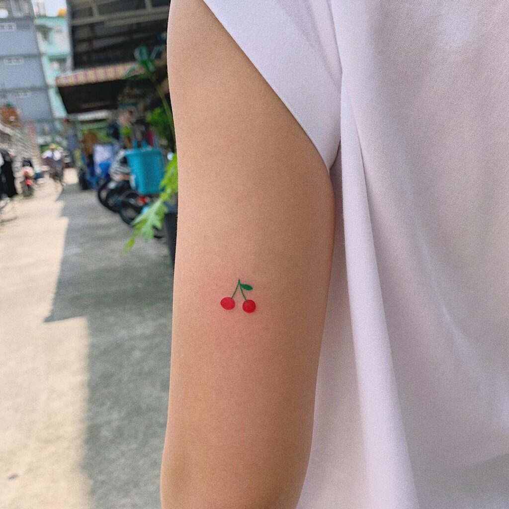 Cherry tattoo on shoulder for women