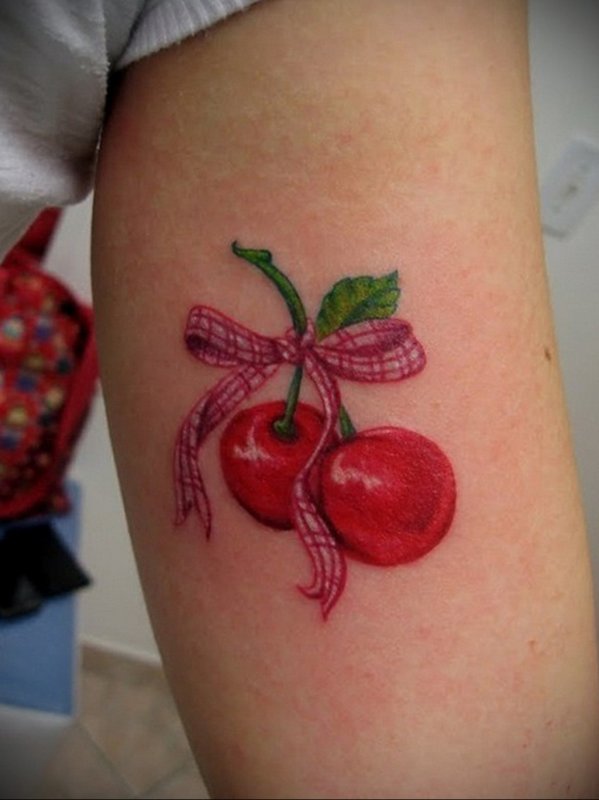 Cherry tattoo on shoulder for women