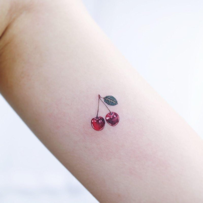 Cherry tattoo on shoulder for women