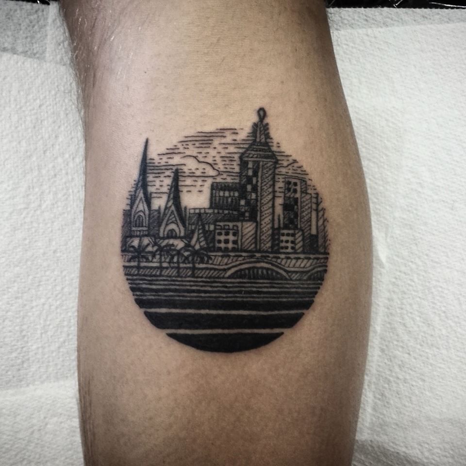 City tattoo on the shin for men