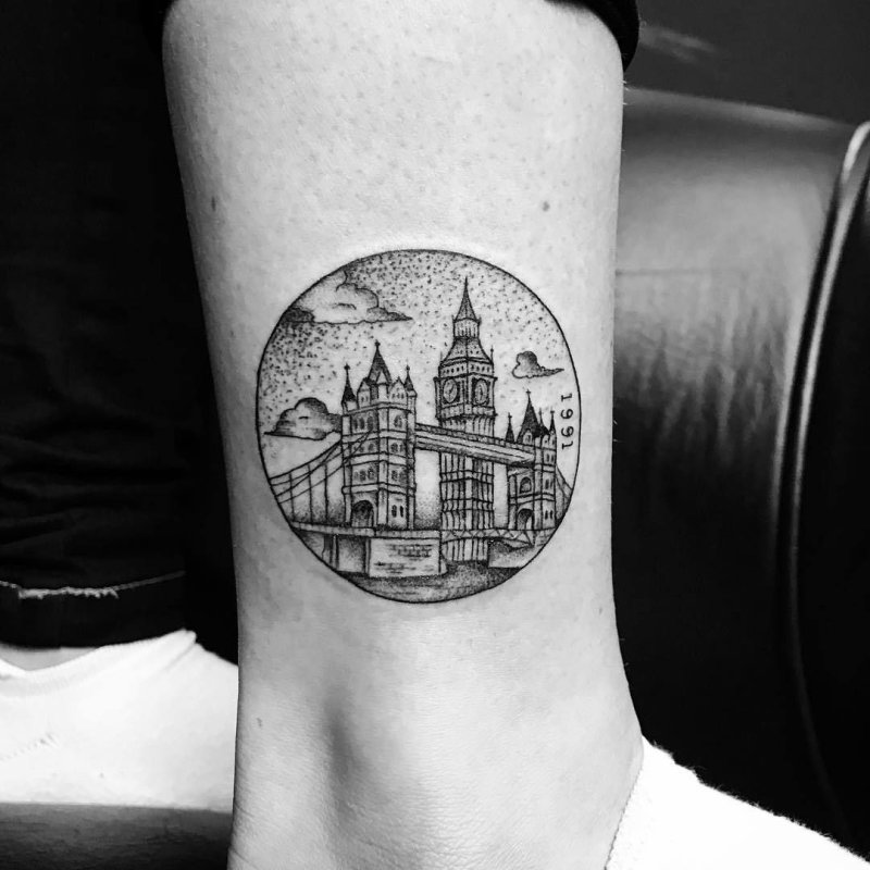 City tattoo on the shin for women