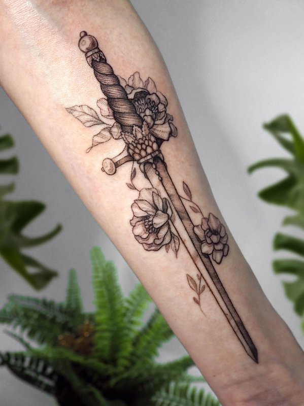 Dagger tattoo on forearm for men