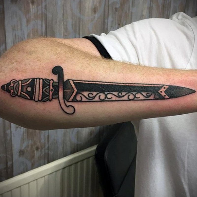 Dagger tattoo on arm for men