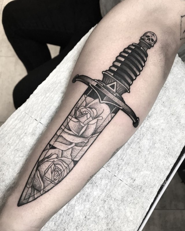 Dagger tattoo on forearm for men