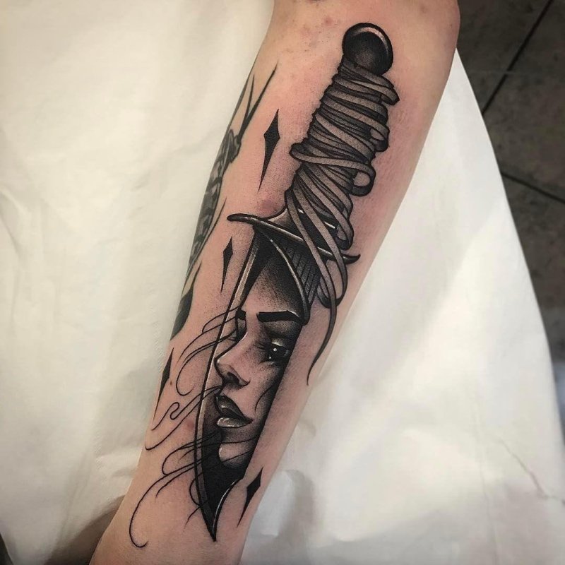 Dagger tattoo on forearm for men