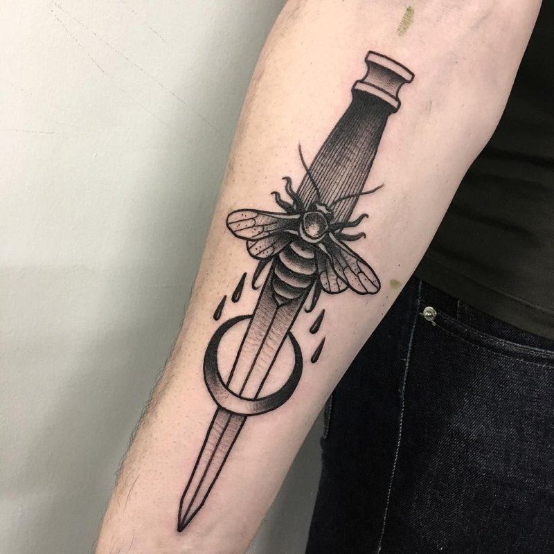 Dagger tattoo on arm for men