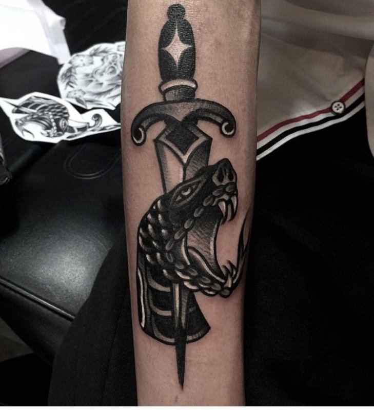 Dagger tattoo on arm for men