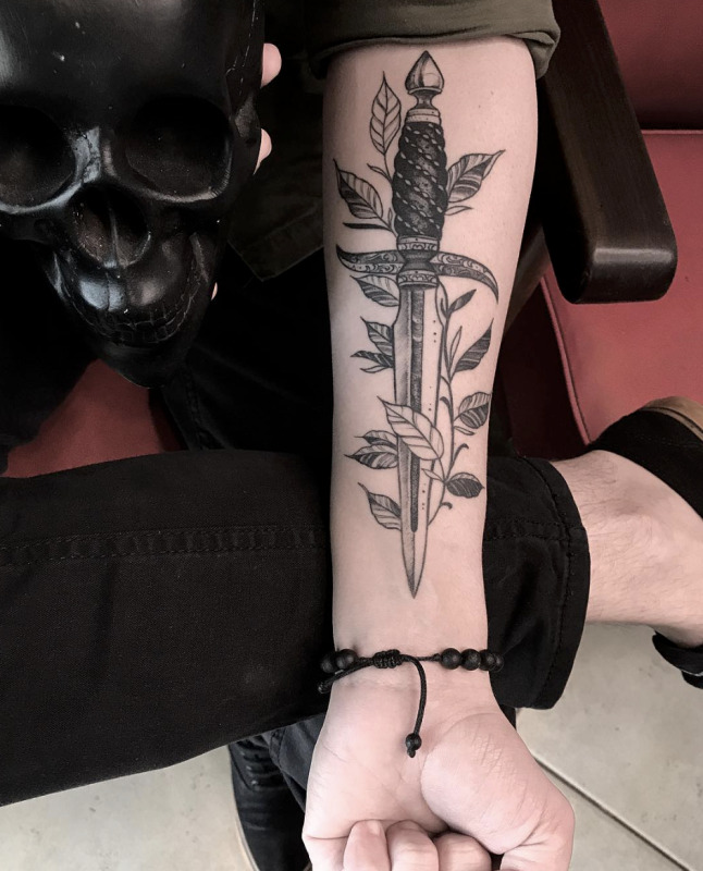 Dagger tattoo on forearm for women