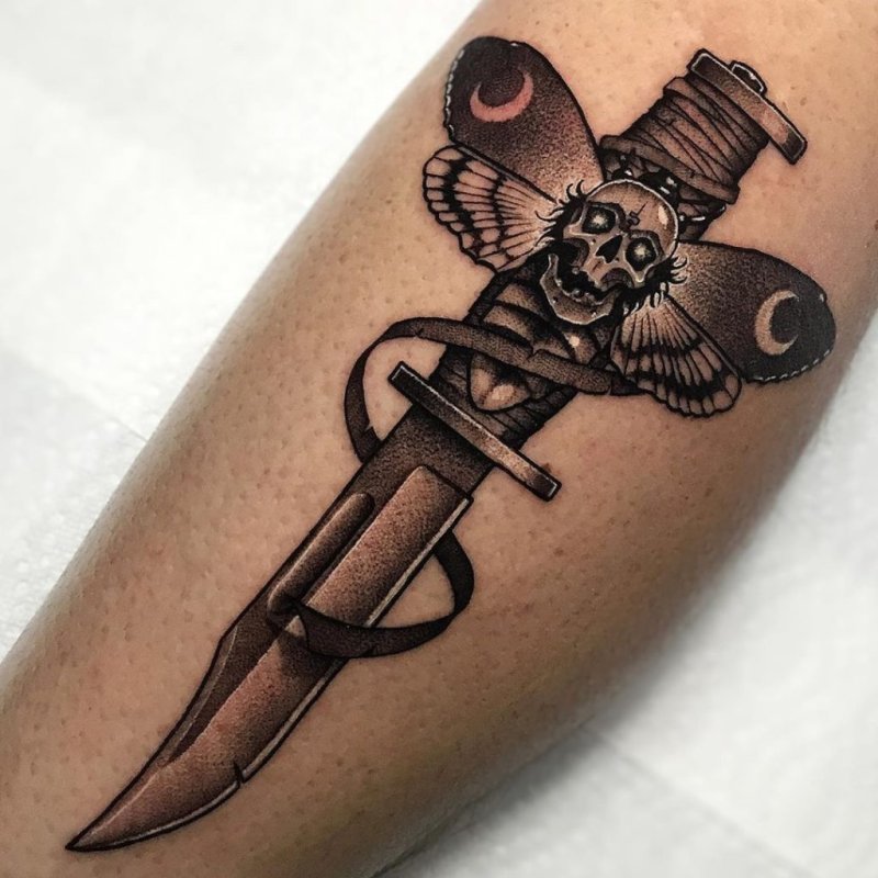 Dagger tattoo on leg for women