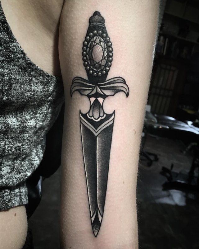 Dagger tattoo on shoulder for women