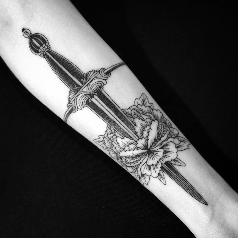 Dagger tattoo on arm for men