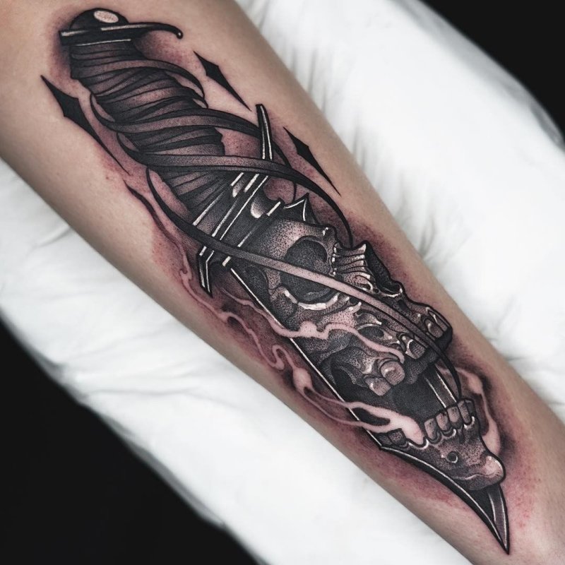 Large dagger tattoo on the leg for men