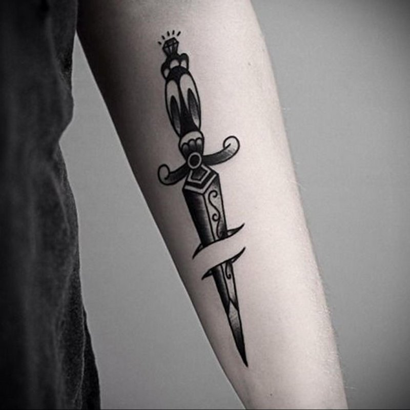 Dagger tattoo on arm for men