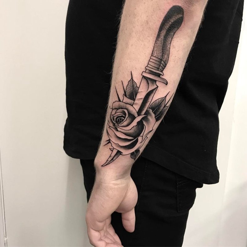 Dagger and rose tattoo on forearm for men