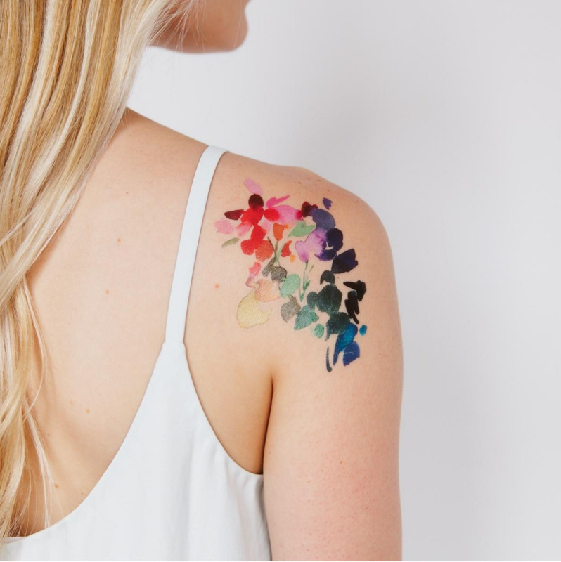 Watercolor style tattoo on the shoulder for women