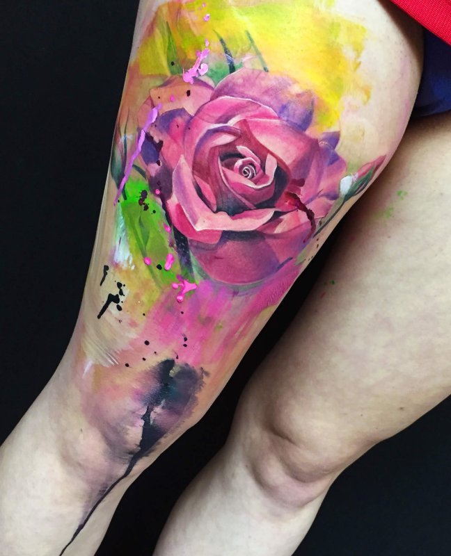 Watercolor style rose tattoo on thigh for women