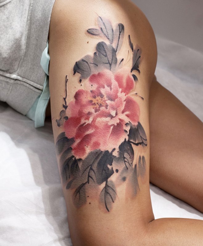 Watercolor style peony tattoo on thigh for women